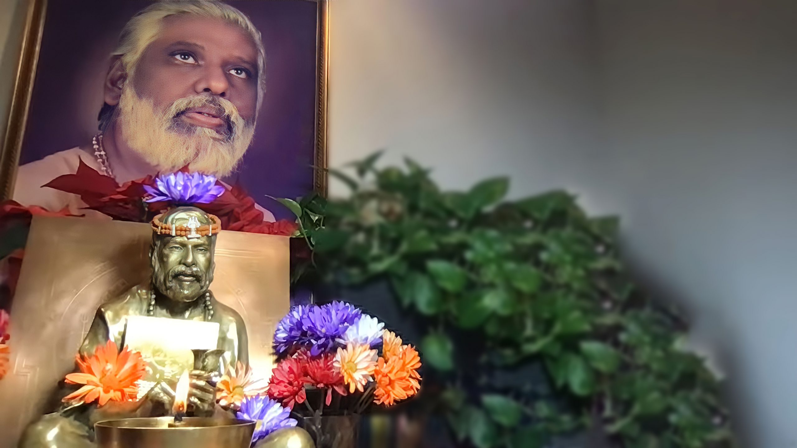 altar with flowers and image of the Guru Dr. Pillai for Full Moon of the Guru, Guru Purnima